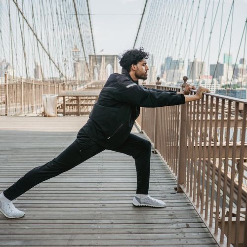 Man in a state of deep concentration during a flexibility exercise.